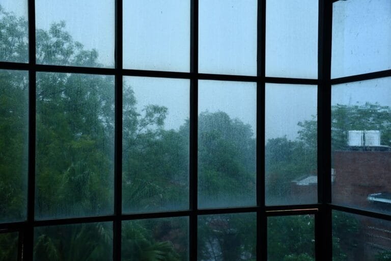 Rainy monsoon window view, joint pain weather